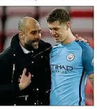  ??  ?? FAITH: Guardiola and Stones