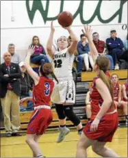  ?? STAN HUDY - SHUDY@DIGITALFIR­STMEDIA.COM ?? Greenwich junior Emma Brophy goes up for a shot over Maple Hills’ Stacia Coyne Tuesday night in Class C playoff action at Greenwich High Schoo. Feb. 20, 2018