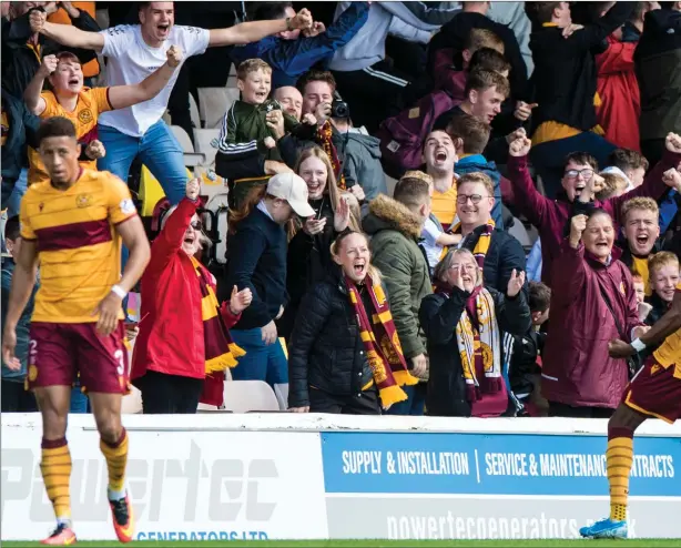  ??  ?? Sherwin Seedorf celebrates with the home support after making it 1-0 to Motherwell at Fir Park as Stephen Robinson’s side registered an impressive 3-0