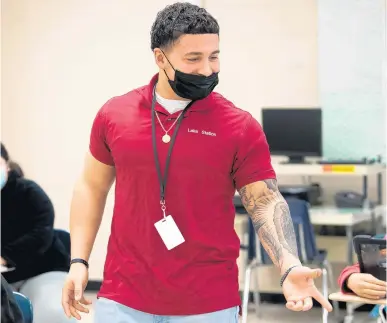  ?? KYLE TELECHAN/POST-TRIBUNE ?? Substitute teacher Angelo Guerra speaks to his students during an English as a second language class at Edison High School on Wednesday.