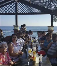  ?? Reyes family enjoying a lobster dinner in Ensenada, Baja California. PHOTO COURTESY OF LIZBETH MEZA ??