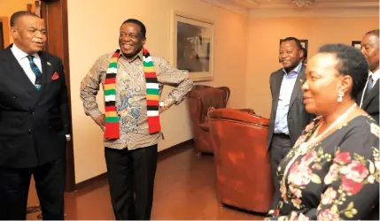  ?? — ?? President Mnangagwa and First Lady Auxillia Mnangagwa share a lighter moment with Vice President Constantin­o Chiwenga at his private residence in Harare yesterday. Picture: Tawanda Mudimu