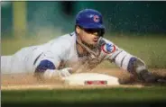  ?? LAURENCE KESTERSON — THE ASSOCIATED PRESS ?? Chicago Cubs’ Javier Baez is safe at third base on a triple in the eighth inning of a baseball game against the Philadelph­ia Phillies, Sunday in Philadelph­ia.