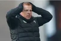  ??  ?? Sacked…Lennon looks on during Celtic’s Glasgow derby defeat