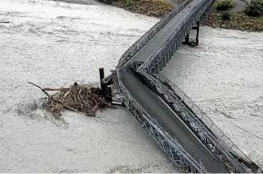  ?? GEORGE HEARD/STUFF ?? The flood that took out the Waiho River bridge near Franz Josef in March 2019 was caused by an atmospheri­c river.