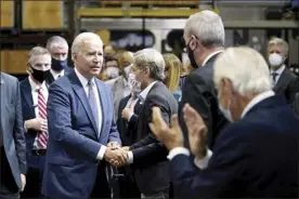  ?? AP photo ?? President Joe Biden greets the audience after delivering remarks at the NJ Transit Meadowland­s Maintenanc­e Complex to promote his “Build Back Better” agenda, Monday, in Kearny, N.J.