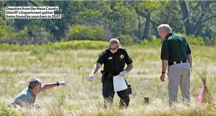  ??  ?? Deputies from the Mesa County Sheriff’s Department gather items found by searchers in 2007