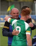  ??  ?? Mick Murtagh congratula­tesWillie Eager at the end of the MFC ‘A’ football final.