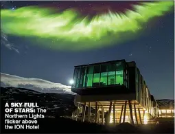  ??  ?? A SKY FULL OF STARS: The Northern Lights flicker above the ION Hotel