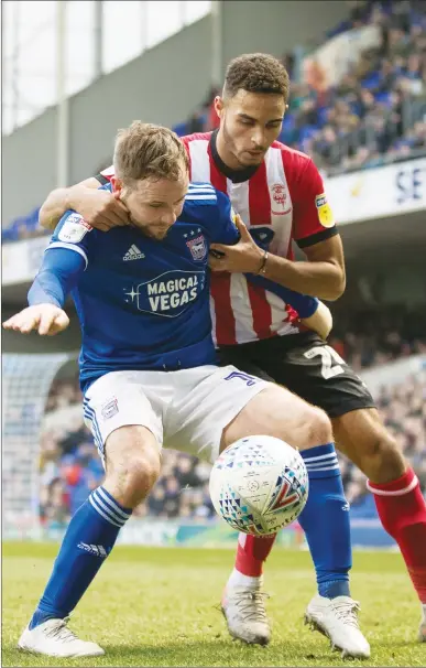  ??  ?? DUEL: Alan Judge of Ipswich holds the ball up under pressure from Max Melbourne of Lincoln