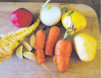  ?? Pam Peirce / Special to The Chronicle ?? Many root crops, such as potatoes, carrots and onions, lend themselves to easy roasting.