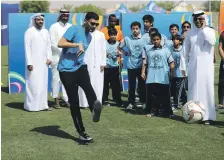  ?? Chris Whiteoak / The National ?? Mohanad Salem joined school children last week and took part in activities to promote the Asian Cup