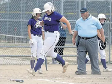  ??  ?? Mountain View’s Bailey Carlson crosses the plate after hitting a home run against Thompson Valley on Aug. 25.