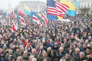  ?? — Reuters ?? Supporters of Ukrainian opposition figure and Georgian former president Mikheil Saakashvil­i hold a rally against Ukraine’s President Petro Poroshenko in Kiev, Ukraine on Sunday.