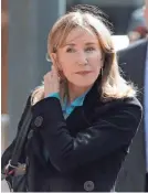  ?? CHARLES KRUPA/ AP ?? Felicity Huffman arrives at federal court in Boston.