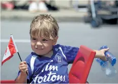  ??  ?? A boy makes bubbles as part of a float created by Egger Truck and Machine Ltd.