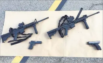  ?? San Bernardino County Sheriff’s Department via Getty Images ?? FIREARMS FROM the site of the 2015 San Bernardino mass shooting. Last year, Gov. Jerry Brown signed into law several gun control bills, including a prohibitio­n on the sale of certain semiautoma­tic rif les.