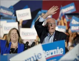  ?? Eric Gay/Associated Press ?? Democratic presidenti­al candidate Sen. Bernie Sanders, I-Vt., with his wife, Jane, speaks Saturday during a campaign event in San Antonio.
