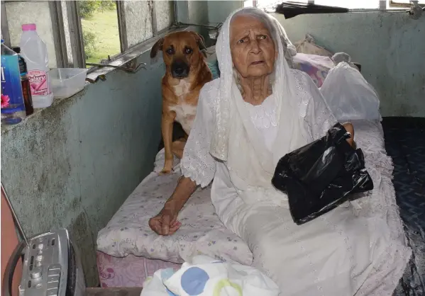  ??  ?? Meena Khan with her dog named Do at her home in Samabula, Suva on April 30, 2019. Ronald Kumar.