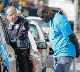  ?? Mark Boster Los Angeles Times ?? AN ARREST during a skid row sweep by the LAPD in 2016. Commission­er Shane Murphy Goldsmith on Tuesday asked the department to reduce arrests.