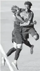  ?? KARL MERTON FERRON/BALTIMORE SUN ?? McDonogh’s Vince Petrera, left, and Joel Brown celebrated a first-half goal against Mount Saint Joseph during an MIAA A Conference matchup Friday.