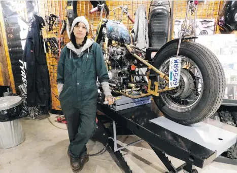  ?? ANDREW McCREDIE ?? Vancouver Motorcycle Collective manager Tori Tucker displays her work-in-progress 1967 Yamaha XS650.