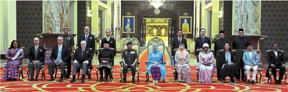  ?? ?? Royal audience: Sultan abdullah and Tunku azizah (centre) flanked by the 12 foreign envoys to malaysia posing for a group photo at the istana Negara here yesterday. — bernama