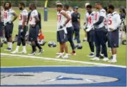  ?? TONY GUTIERREZ — THE ASSOCIATED PRESS ?? Houston Texans players stand on the sideline waiting to run sprints at the start of a morning practice at the Dallas Cowboys training facility Monday in Frisco, Texas. The Texans are working out in the practice facility of the Dallas Cowboys because of...