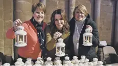  ??  ?? Judy Gregory, Kerry Ash and Lisa Manton with lanterns at Lights of Love.