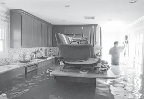  ?? Janus Lazaris ?? The Meyerland home of Janus and John Lazaris flooded during Tropical Storm Harvey.