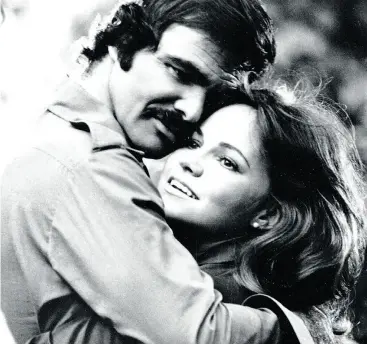  ?? WENN.COM ?? Burt Reynolds and Sally Field in 1977’s Smokey and the Bandit. The attraction between Field and Reynolds was “instantane­ous and intense,” but in their four-year relationsh­ip he would turn out to be self-centred and controllin­g, she writes.