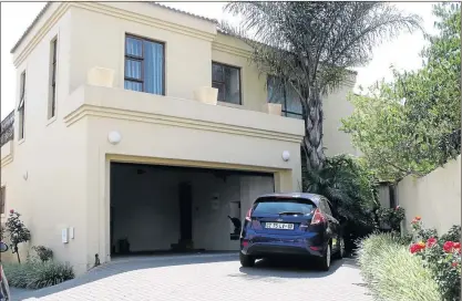  ??  ?? HOT PROPERTY: This upmarket double-storey Midrand residence is waiting for the right owners. It will be auctioned on Monday morning