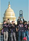  ?? JOSE LUIS MAGANA/AP ?? Nationals players raise the World Series trophy during a parade in Washington on Nov. 2, 2019.