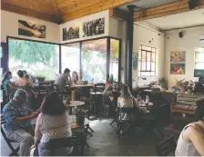  ?? SARA LIEBERMAN/FOR THE WASHINGTON POST ?? Visitors enjoy a meal at Assaf Winery’s Adika Cafe in the Golan Heights.