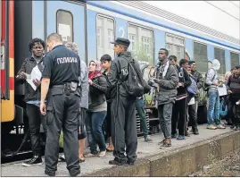  ?? Picture: AFP ?? UNCERTAIN FUTURE: Migrants prepare to enter a train to Serbia in the town of Gevgelija, on the Macedonian-Greek border, on their way north to European countries on Tuesday. More than 100 000 migrants have crossed the Mediterran­ean so far this year alone