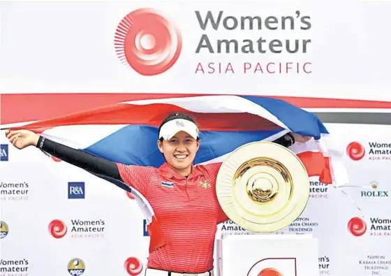  ??  ?? Atthaya Thitikul is full of joy after winning the Women’s Amateur Asia Pacific title in Singapore yesterday.