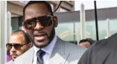 ?? ASHLEE REZIN/SUN-TIMES FILE ?? R. Kelly leaves Leighton Criminal Courthouse with supporters in June 2019.