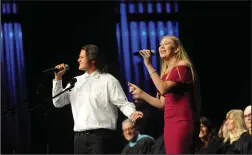  ??  ?? Gabriel Montesano and Taylor Little perform “Seasons of Love” from the musical “Rent” during the Liberty Ranch commenceme­nt ceremony.