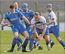  ?? Photograph: Iain Ferguson, alba.photos ?? Innes Blackhall tackles Chris Holleysong to deflect action away from the Kilmallie goal.