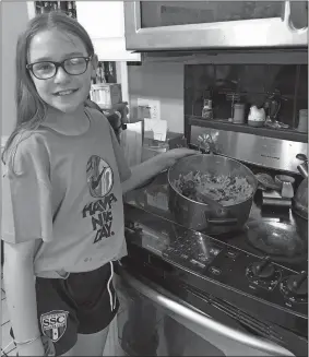  ?? PHOTO COURTESY OF TOM BUTLER/SSC ?? Norwich’s Ava Conley, a member of the Southeast Soccer Club’s 2008 girls’ team, cooked her family a pasta dinner for her “Home Cooking” team challenge during the current COVID-19 lockdown.