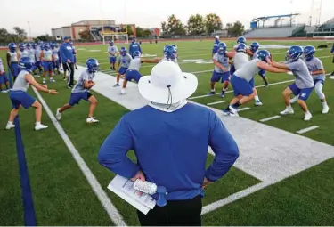  ?? Photos by Jerry Lara / Staff photograph­er ?? Coach Phil Barron observes his players during the first fall practice for South San. Barron, returning to his alma mater after two seasons at Burbank, called the experience “still kind of surreal for me to be back home.”