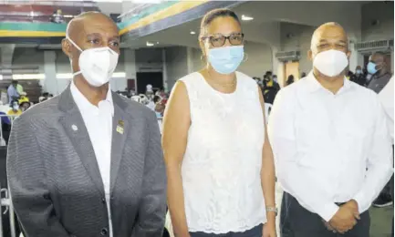  ?? (Photo: Dwayne Richards) ?? New JAAA President Garth Gayle (left) and Honorary Secretary Marie Tavares (centre) along with returning director of records Leroy Cooke shortly after the announceme­nt of the results following the JAAA elections at the National Arena last Saturday.