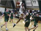  ?? CHRIS RILEY — TIMES-HERALD ?? St. Patrick-St. Vincent’s Jaden Alexander draws a foul as the Bruins come from behind to defeat San Ramon Valley, 58-57, in the NorCal playoffs on Tuesday.