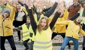  ??  ?? French jazz singer Marguerite Laissy says ‘‘gilets jaunes’’ protesters have been demonised by the media, so she wrote a song supporting them.