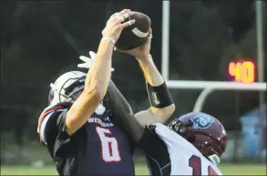  ?? Christian Abraham / Hearst Connecticu­t Media ?? Dean College’s Tywan Jones breaks up a pass intended for WestConn’s Will Daniels during the Colonials 4116 on Saturday in Danbury.