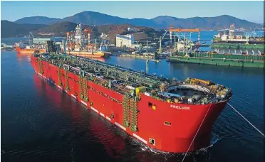  ??  ?? Big loss: A file picture showing a tanker-shaped vessel at a southern shipyard in Geoje in South Korea. Samsung Heavy Industries says it expects an operating loss of US$220mil in the next financial year. — AP