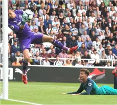  ??  ?? Tottenham Hotspur’s English midfielder Dele Alli (right) watches as Newcastle United’s Slovakian goalkeeper Martin Dubravka saves his shot during the English Premier League football match between Newcastle United and Tottenham Hotspur at St James’ Park in Newcastle-upon-Tyne, north east England. — AFP photo