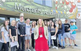  ??  ?? Merchants Academy principal Samantha Williamson pictured with some of her students in 2018