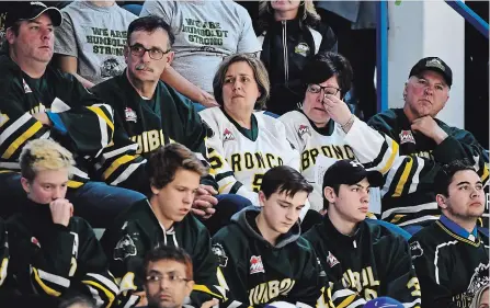  ?? JONATHAN HAYWARD THE CANADIAN PRESS ?? Mourners attend a vigil at the Elgar Petersen Arena, home of the Humboldt Broncos, to honour the victims of a fatal bus accident, in Humboldt, Sask. on April 8, 2018. Broncos chaplain Sean Brandow will speak Thursday after the firth annual Petes Faith Night game at the Memorial Centre.
