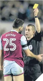  ??  ?? Aston Villa’s Mile Jedinak gets booked.